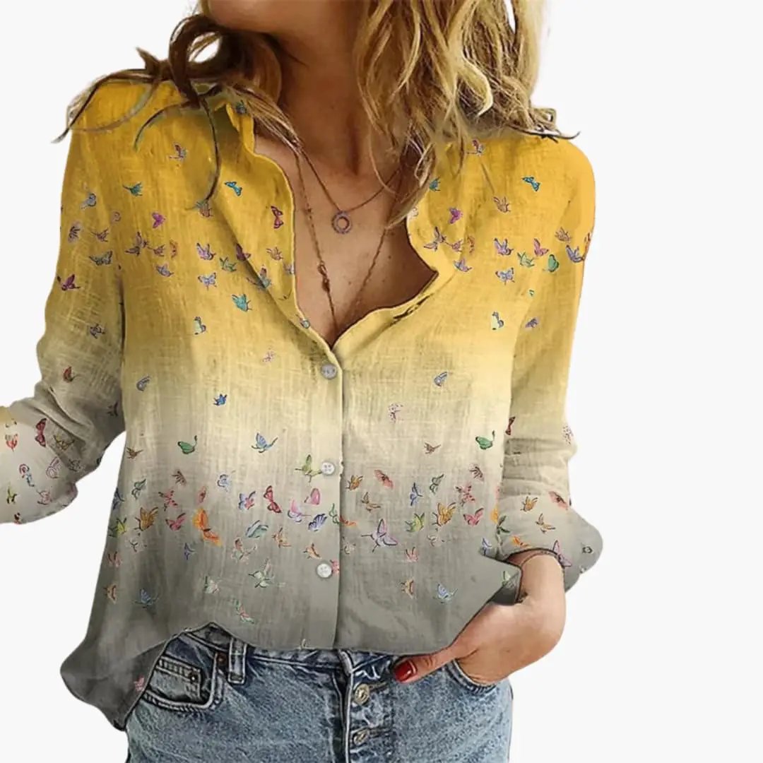 https://cdn.shopify.com/s/files/1/0980/8547/0533/files/Women_sArtisticPrintV-NeckBlouse_LongSleeveTop_7.jpg?v=1777384441