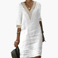 https://cdn.shopify.com/s/files/1/0980/8547/0533/files/Women_sKnee-LengthDresswithRoundNeckandShortSleeves_1.jpg?v=1777384890
