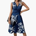 https://cdn.shopify.com/s/files/1/0980/8547/0533/files/Women_sSleevelessV-NeckFloralMidiDress_1.jpg?v=1777384493