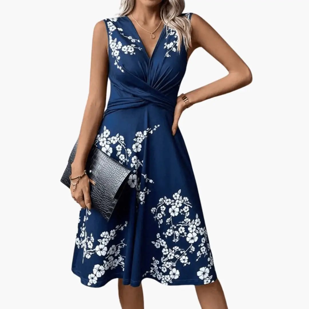 https://cdn.shopify.com/s/files/1/0980/8547/0533/files/Women_sSleevelessV-NeckFloralMidiDress_1.jpg?v=1777384493