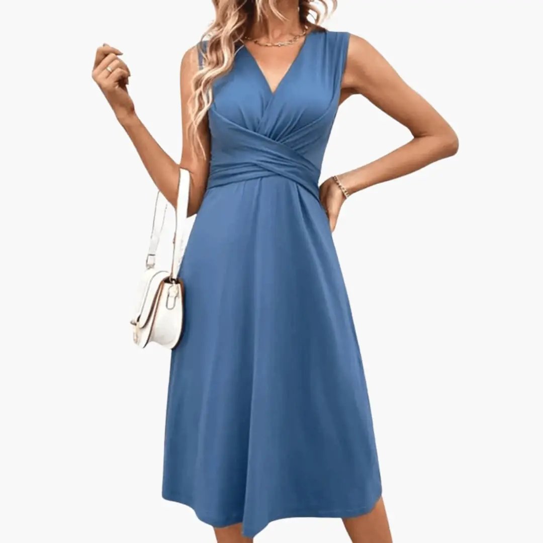 https://cdn.shopify.com/s/files/1/0980/8547/0533/files/Women_sSleevelessV-NeckFloralMidiDress_2.jpg?v=1777384493