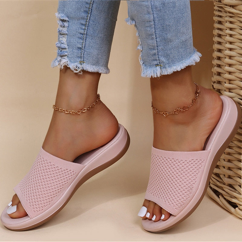 https://cdn.shopify.com/s/files/1/0902/1236/8707/files/womens-light-pink-breathable-orthopaedic-sliders.jpg?v=1751440952