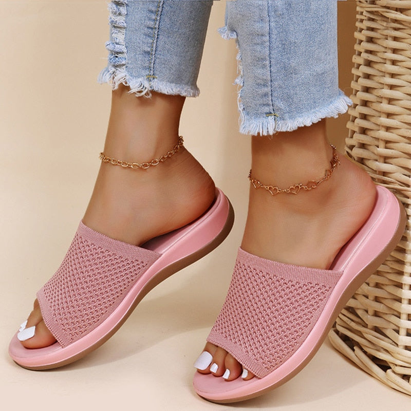 https://cdn.shopify.com/s/files/1/0902/1236/8707/files/womens-pink-breathable-orthopaedic-sliders.jpg?v=1751440895